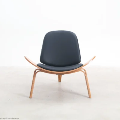 Microfiber leather Shell Chair in natural plywood by Hans Wegner, front facing view.