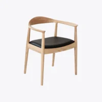 A modern wooden chair with a curved backrest and armrests, light wood finish, and a black upholstered seat, shown against a plain white background.
