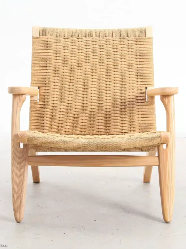 Front view of Hans Wegner's CH25 Easy Chair, highlighting the woven paper cord seat and backrest with the solid wooden frame.