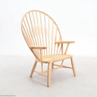 Paper rope Peacock Chair in natural ash by Hans Wegner, front right facing view.