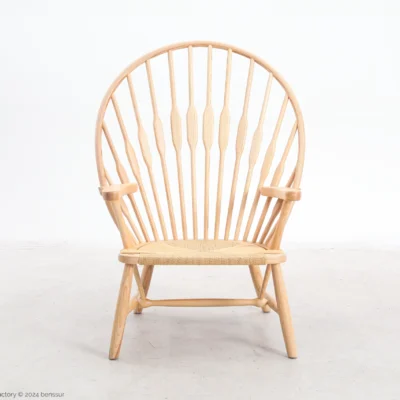 Paper rope Peacock Chair in natural ash by Hans Wegner, front facing view.