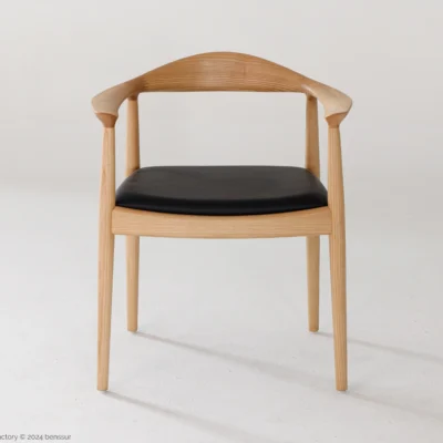 Microfiber Round Chair in natural ash by Hans Wegner, front facing view.