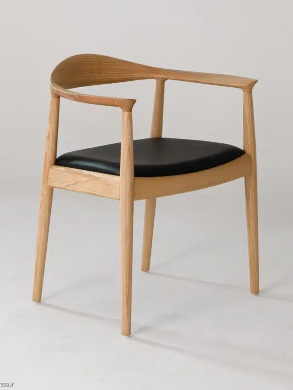 Microfiber Round Chair in natural ash by Hans Wegner, front right facing view.