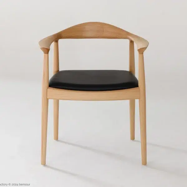 Microfiber Round Chair in natural ash by Hans Wegner, front facing view.