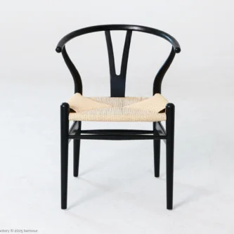 Front view of A solid ashwood wishbone chair finished in black.