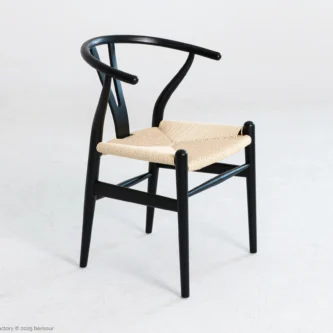 A solid ashwood wishbone chair finished in black.