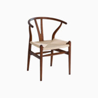 A wooden dining chair with a curved backrest, Y-shaped support, and a woven natural fibre seat, set against a plain white background.