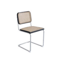A modern chair with a chrome cantilever frame, black edges, and a woven cane seat and backrest.