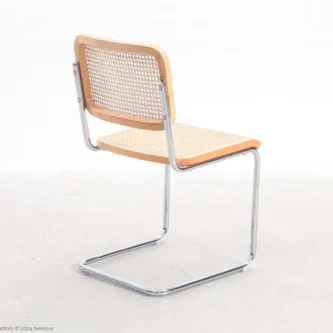 Woven caning B32 Cesca Chair in natural beech by Marcel Breuer, back right facing view.