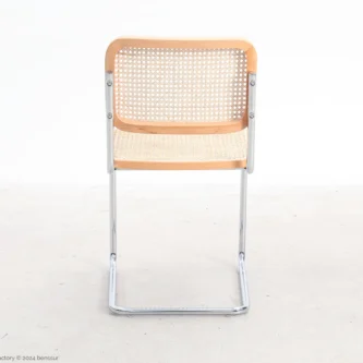 Woven caning B32 Cesca Chair in natural beech by Marcel Breuer, back facing view.