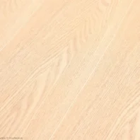 Light-coloured wooden surface with a smooth finish and visible wood grain patterns running diagonally across the image. The texture appears natural and clean, suitable for flooring or furniture.
