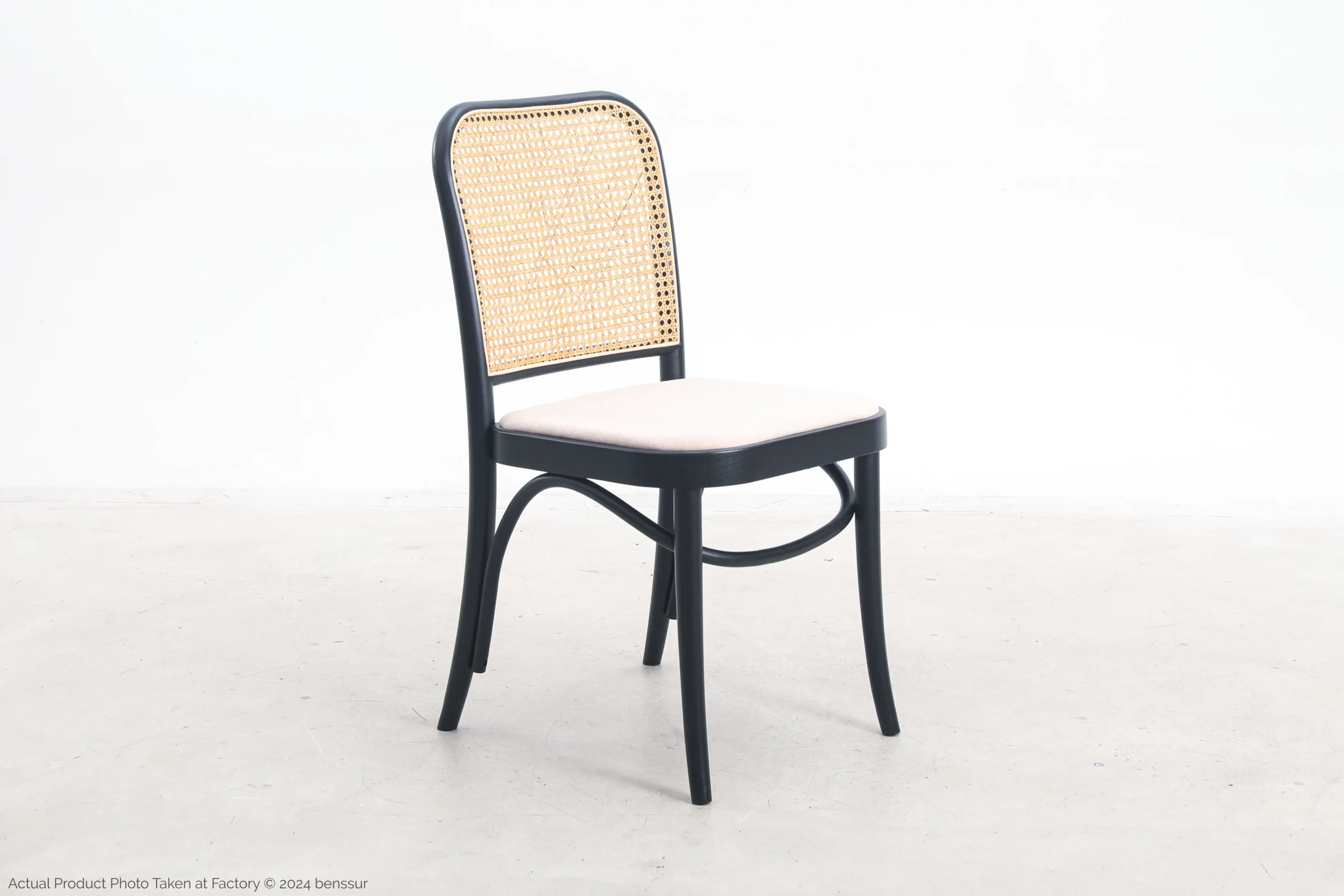 Upholstered No.811 Chair in black ash by Josef Hoffmann, front right facing view.