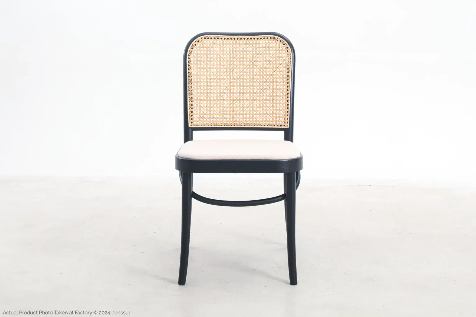 Josef Hoffmann_No811 Chair_Replica_Upholstered_Black_Ash_Front A chair with a woven back.