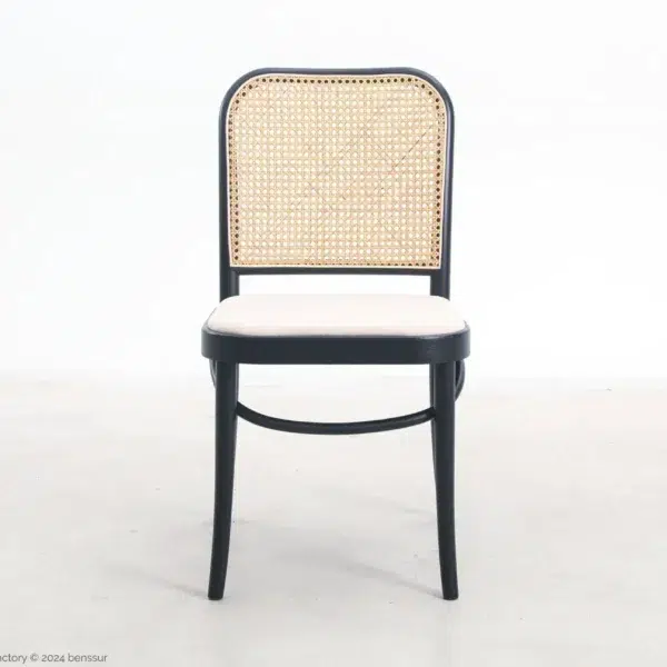 A chair with a woven back.