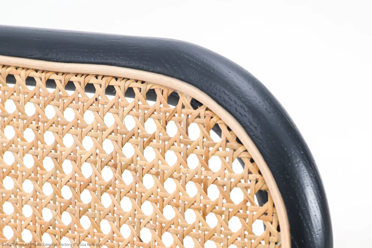 Josef Hoffmann_No811 Chair_Replica_Woven Caning_Black_Ash_Detail_2 Close-up of a chair back with a black wooden frame and woven cane rattan in a natural light tan colour, showing detailed craftsmanship against a white background.
