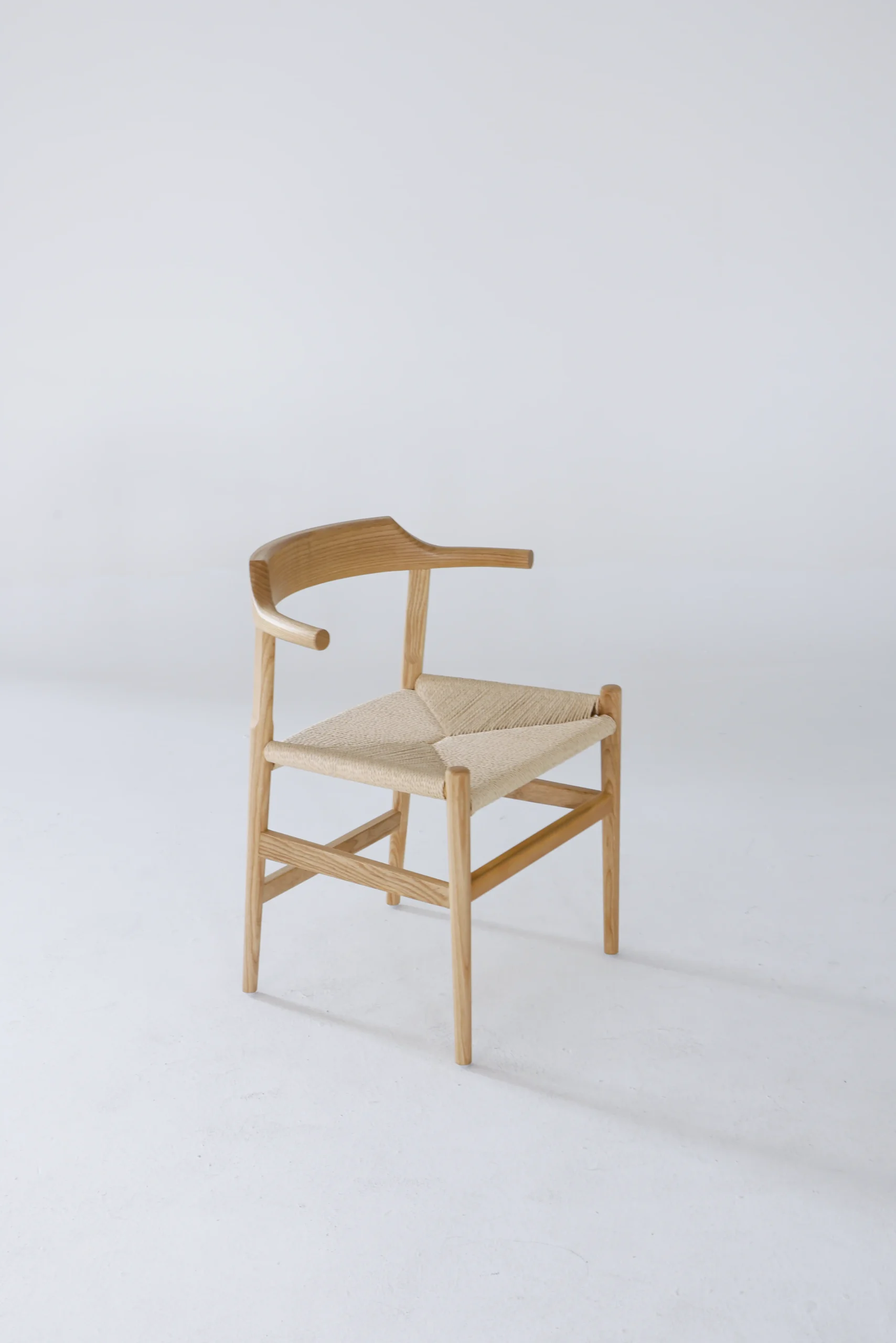 Front-side angle of Hans Wegner's Final Chair, also known as PP68, showcasing its clean lines and ergonomic design.