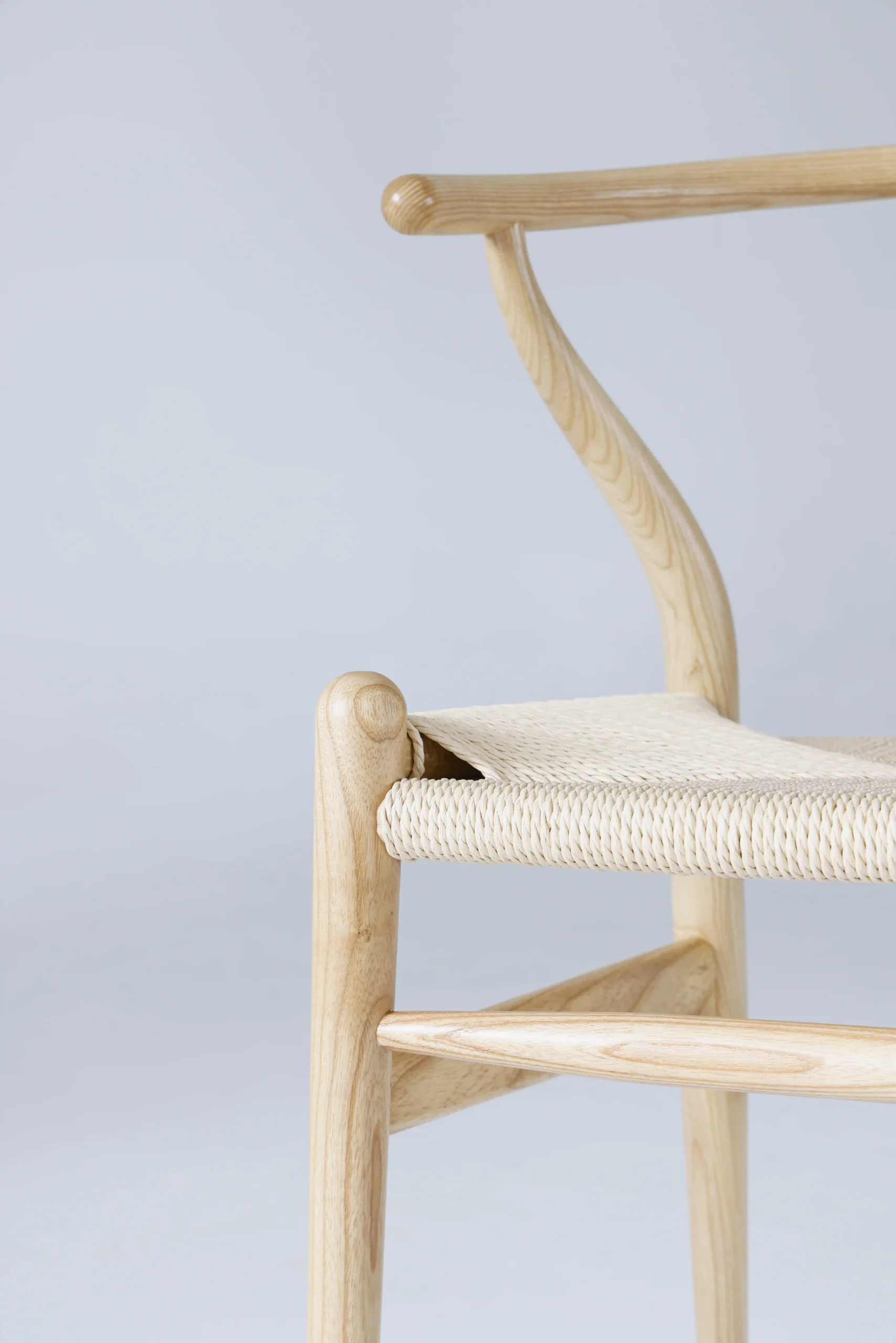 Detail of Hans Wegner's Wishbone Chair in natural, highlighting the beautiful grain of European ash timber.