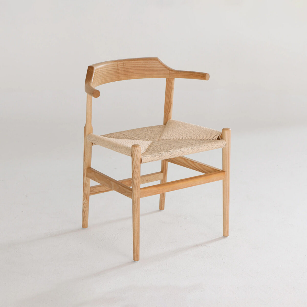 Final Chair_Paper Robe_B11 A wooden chair with a curved backrest and woven seat, featuring simple, minimalist design on a plain white background.