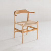 A wooden chair with a curved backrest and woven seat, featuring simple, minimalist design on a plain white background.