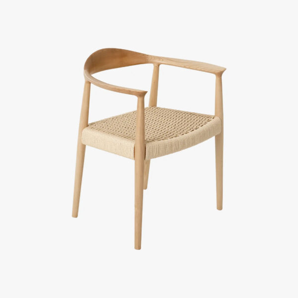 A wooden chair with a curved backrest and woven seat, featuring minimalist Scandinavian design with light-coloured wood and clean lines.