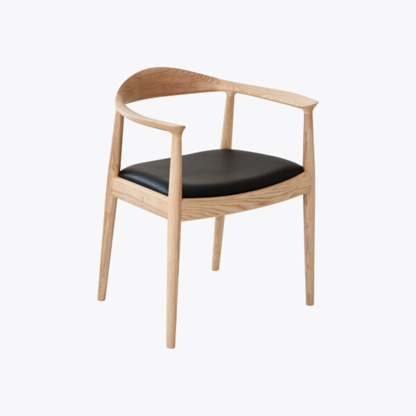 A modern wooden chair with a curved backrest, slender legs, and a black upholstered seat, set against a plain white background.
