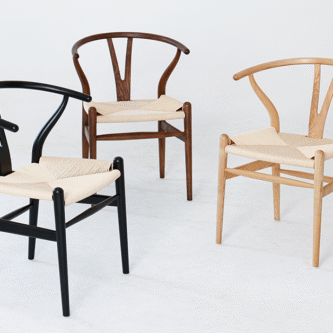 View of three solid ashwood wishbone chair finished in black dark brown and natural.