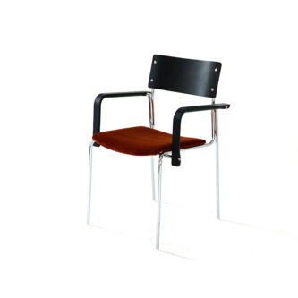 Dining chair with black timber backrest and arms, tan fabric seat and steel legs on a white background.