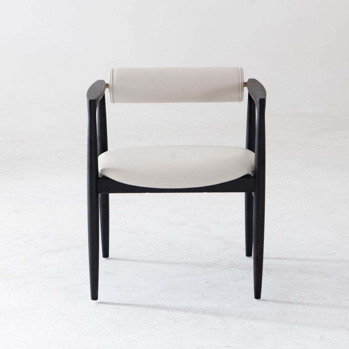 Black Frame + White Seat_B5 A modern chair with a black wooden frame, light-coloured cushioned seat, and a matching cylindrical backrest, set against a plain white background.