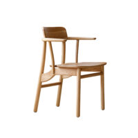 A modern wooden chair with a curved backrest, integrated armrests, and smooth, rounded edges, shown against a white background.