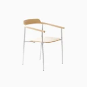 A minimalist chair with a light wooden seat, backrest, and armrests, supported by four slender metal legs. The design is modern and sleek, set against a plain white background.