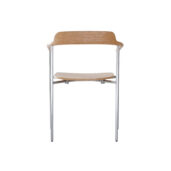 A minimalist wooden chair with a curved backrest and seat, supported by slim, silver metal legs, photographed against a plain white background.