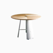 a grey backgound of timber top round dining chair, monet dining chair, with 3 metal legs.