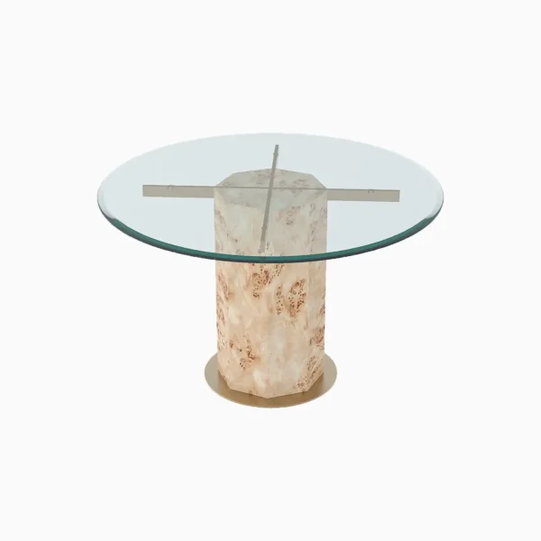 Round glass-top table with a cylindrical, cream-coloured textured base and metallic crossbars supporting the glass.