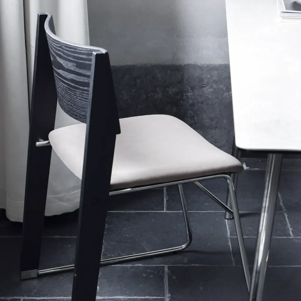 A chair next to a table.