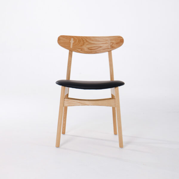 A wooden chair with a curved backrest and light wood finish, featuring a black upholstered seat, set against a plain white background.