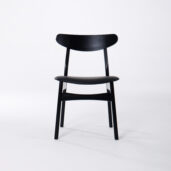 A black wooden chair with a curved backrest and simple, modern design, shown against a plain white background.
