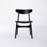 A black wooden chair with a curved backrest and simple, modern design, shown against a plain white background.